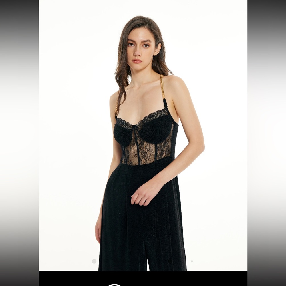 Lace jumpsuit nwt size medium chain straps. Black